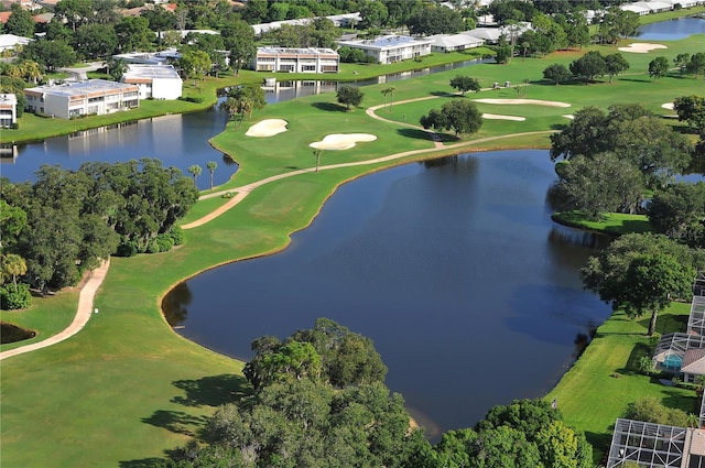 4920 Woodhurst Dr, Sarasota, FL 34243 - bird's eye view of a golf course, a nearby body of water, and a tree filled landscape