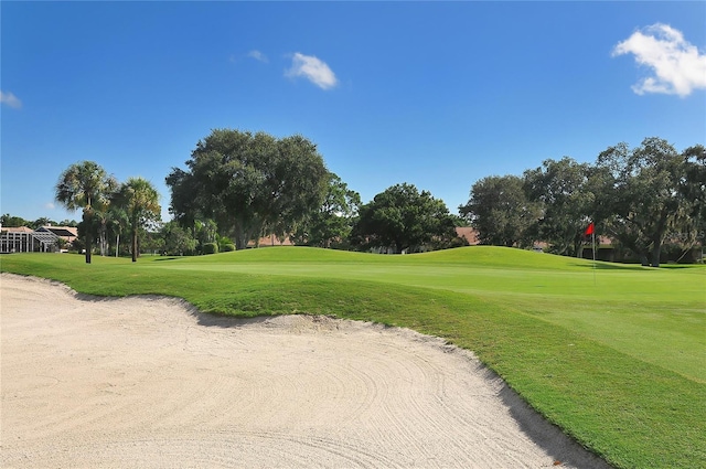 4920 Woodhurst Dr, Sarasota, FL 34243 - view of home's community with view of golf course and a lawn