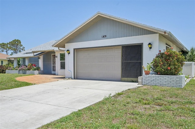 104 Hourglass Dr, Venice, FL 34293 - single story home featuring a garage, concrete driveway, a front yard, and stucco siding
