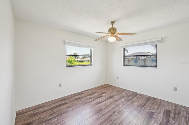 104 Hourglass Dr, Venice, FL 34293 - empty room featuring wood finished floors, ceiling fan, and a textured ceiling