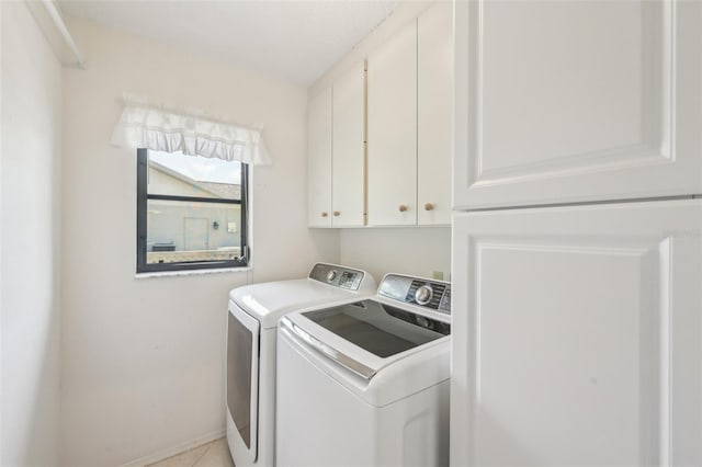 104 Hourglass Dr, Venice, FL 34293 - washroom with cabinet space, separate washer and dryer, baseboards, and light tile patterned flooring