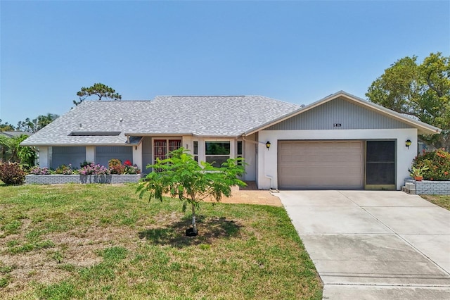 104 Hourglass Dr, Venice, FL 34293 - single story home with a garage, concrete driveway, a front yard, and solar panels