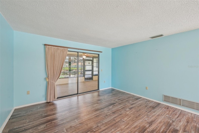 104 Hourglass Dr, Venice, FL 34293 - empty room with wood finished floors, a textured ceiling, baseboards, and ceiling fan