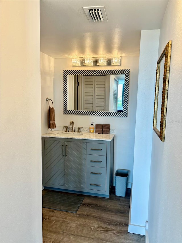 5855 Midnight Pass Rd Unit 621, Sarasota, FL 34242 - bathroom featuring wood finished floors and vanity