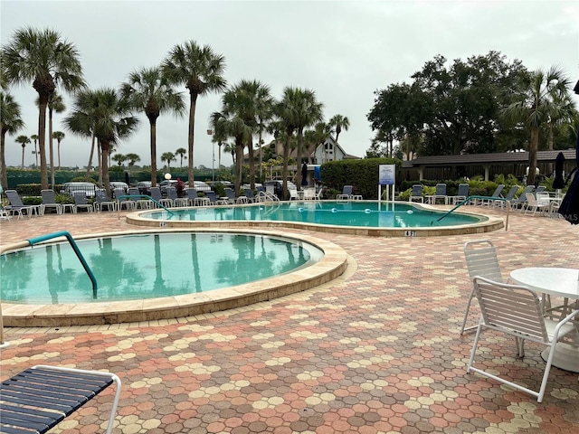 5855 Midnight Pass Rd Unit 621, Sarasota, FL 34242 - community pool featuring a patio area