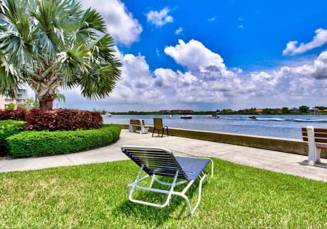 5855 Midnight Pass Rd Unit 621, Sarasota, FL 34242 - view of home's community with a water view and a lawn