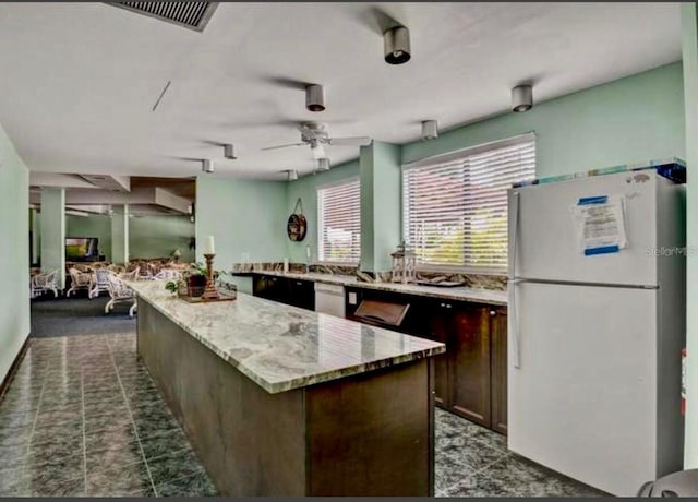 5855 Midnight Pass Rd Unit 621, Sarasota, FL 34242 - kitchen with white appliances, a center island, a ceiling fan, and healthy amount of natural light