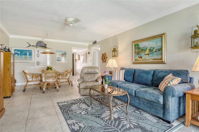 4840 Gulf Of Mexico Dr Unit 15, Longboat Key, FL 34228 - living room with a textured ceiling, ornamental molding, light tile patterned flooring, ceiling fan, and baseboards