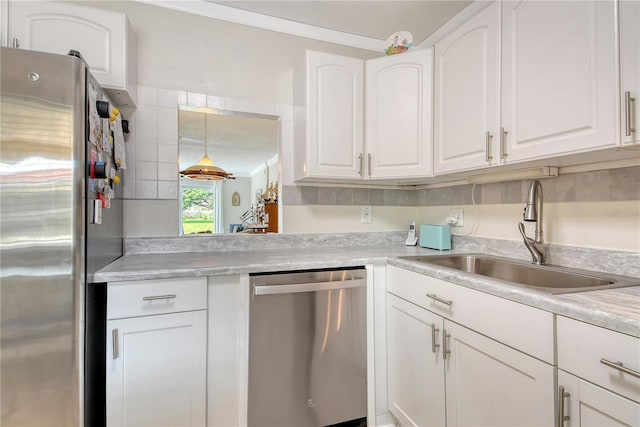 4840 Gulf Of Mexico Dr Unit 15, Longboat Key, FL 34228 - kitchen with stainless steel appliances, a sink, white cabinets, and light countertops