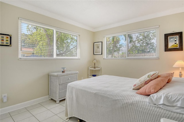 4840 Gulf Of Mexico Dr Unit 15, Longboat Key, FL 34228 - bedroom with baseboards, light tile patterned floors, and ornamental molding