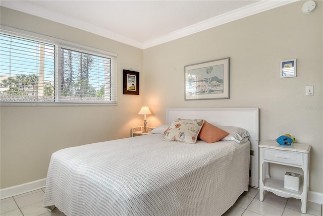 4840 Gulf Of Mexico Dr Unit 15, Longboat Key, FL 34228 - bedroom with crown molding, light tile patterned floors, and baseboards