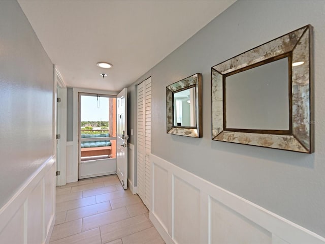 4550 Pinebrook Cir Unit 608, Bradenton, FL 34209 - doorway to outside with a wainscoted wall and a decorative wall