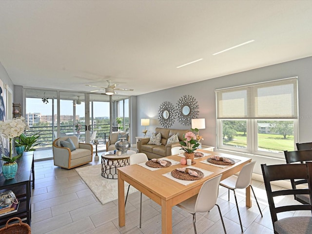 4550 Pinebrook Cir Unit 608, Bradenton, FL 34209 - living area featuring ceiling fan and a wall of windows