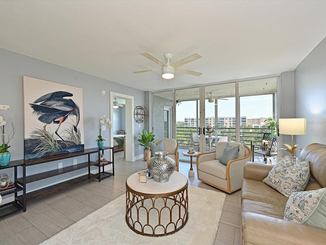 4550 Pinebrook Cir Unit 608, Bradenton, FL 34209 - living room featuring expansive windows, a ceiling fan, and baseboards