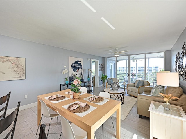 4550 Pinebrook Cir Unit 608, Bradenton, FL 34209 - dining space with expansive windows, ceiling fan, baseboards, and light wood-type flooring
