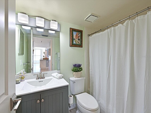 4550 Pinebrook Cir Unit 608, Bradenton, FL 34209 - bathroom featuring vanity, toilet, and a shower with shower curtain