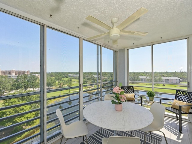4550 Pinebrook Cir Unit 608, Bradenton, FL 34209 - sunroom / solarium featuring ceiling fan, a water view, and plenty of natural light