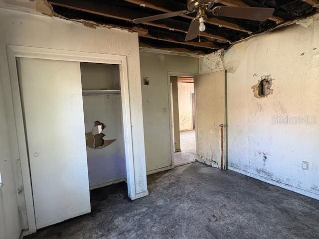 1758 35th St, Sarasota, FL 34234 - unfurnished bedroom featuring concrete floors and a closet