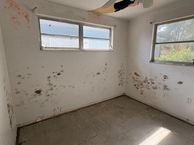 1758 35th St, Sarasota, FL 34234 - empty room with plenty of natural light and ceiling fan