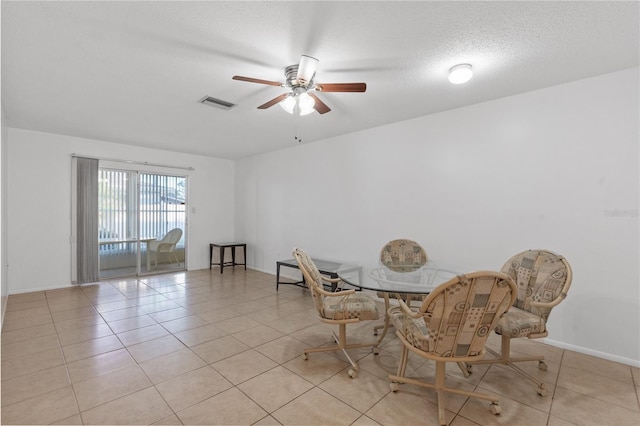 505 47th Avenue Dr W, Bradenton, FL 34207 - dining space featuring ceiling fan, light tile patterned floors, a textured ceiling, and baseboards