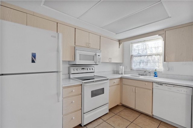 505 47th Avenue Dr W, Bradenton, FL 34207 - kitchen with white appliances, a sink, light countertops, and light tile patterned floors