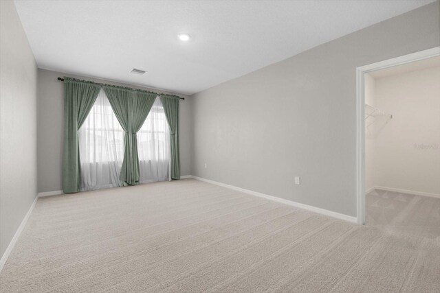 4015 Quiet Rain Ct, Palmetto, FL 34221 - spare room with light carpet, baseboards, and recessed lighting