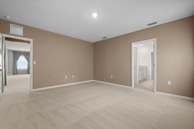 4015 Quiet Rain Ct, Palmetto, FL 34221 - spare room with light colored carpet, baseboards, and a smoke detector