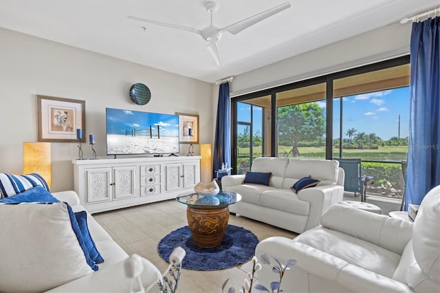 23528 Awabuki Dr Unit 101, Venice, FL 34293 - tiled living room with healthy amount of natural light and a ceiling fan