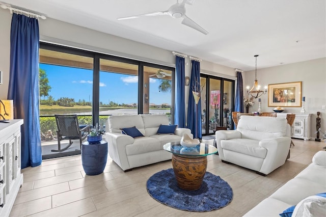 23528 Awabuki Dr Unit 101, Venice, FL 34293 - living area with ceiling fan and a chandelier