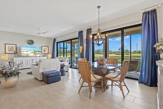 23528 Awabuki Dr Unit 101, Venice, FL 34293 - dining room featuring a chandelier and a ceiling fan