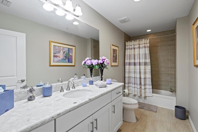 23528 Awabuki Dr Unit 101, Venice, FL 34293 - full bathroom with toilet, recessed lighting, vanity, and shower / bath combo