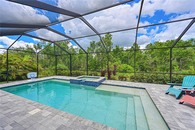 8916 Isabella Cir, Parrish, FL 34219 - view of swimming pool featuring a pool with connected hot tub, a lanai, and a patio area