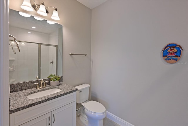 8916 Isabella Cir, Parrish, FL 34219 - full bathroom featuring a stall shower, toilet, vanity, baseboards, and tile patterned flooring