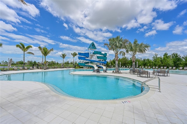 8916 Isabella Cir, Parrish, FL 34219 - community pool featuring a water slide and a patio area