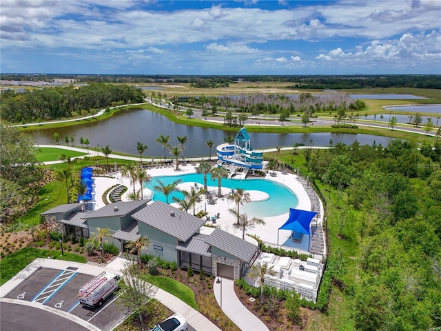 8916 Isabella Cir, Parrish, FL 34219 - drone / aerial view of a pool, a large body of water, and a tree filled landscape