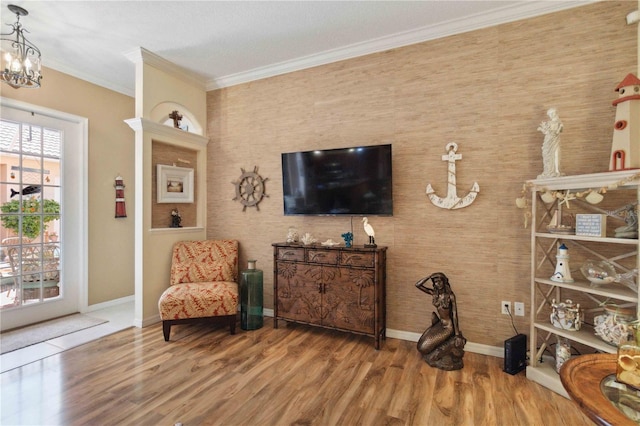 4804 Jacaranda Heights Dr, Venice, FL 34293 - sitting room with ornamental molding, wood finished floors, baseboards, and a chandelier