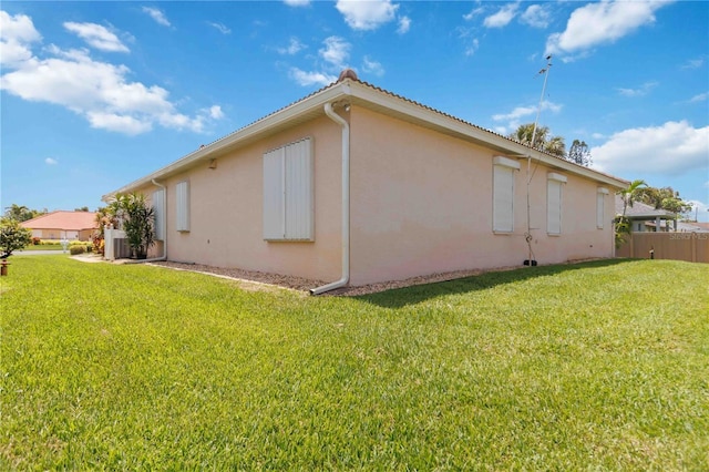 4804 Jacaranda Heights Dr, Venice, FL 34293 - view of side of property featuring stucco siding and central AC