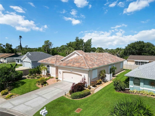 4804 Jacaranda Heights Dr, Venice, FL 34293 - view of front of property featuring stucco siding, a front yard, an attached garage, and driveway