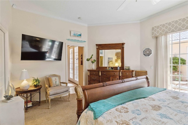 4804 Jacaranda Heights Dr, Venice, FL 34293 - carpeted bedroom featuring ornamental molding, access to exterior, a ceiling fan, and baseboards