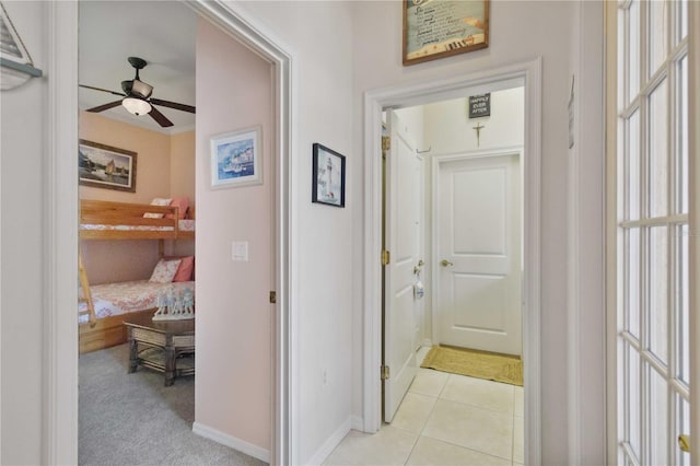4804 Jacaranda Heights Dr, Venice, FL 34293 - hallway featuring baseboards and light tile patterned floors
