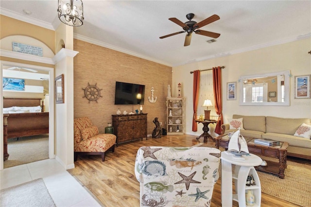 4804 Jacaranda Heights Dr, Venice, FL 34293 - living room with a ceiling fan, crown molding, baseboards, and wood finished floors