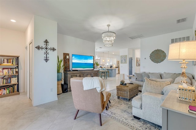 living room featuring a chandelier and light tile patterned flooring