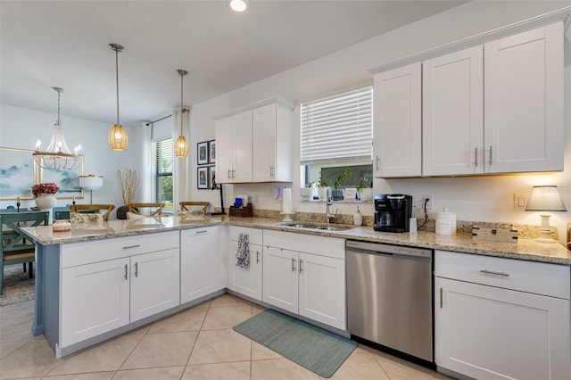 kitchen with stainless steel dishwasher, a sink, a peninsula, white cabinetry, and pendant lighting