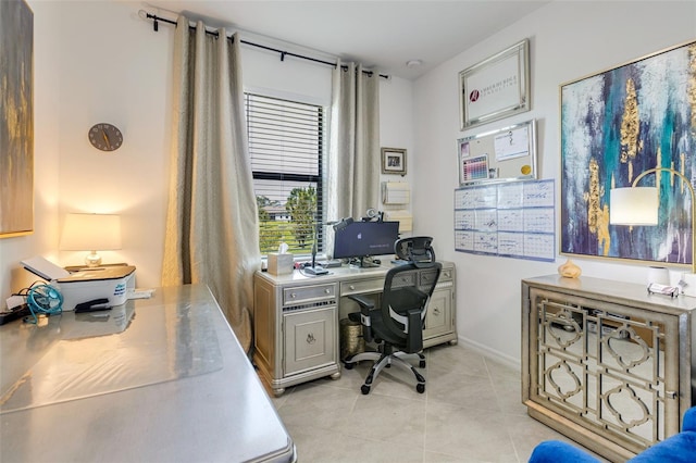 office area featuring light tile patterned flooring and baseboards