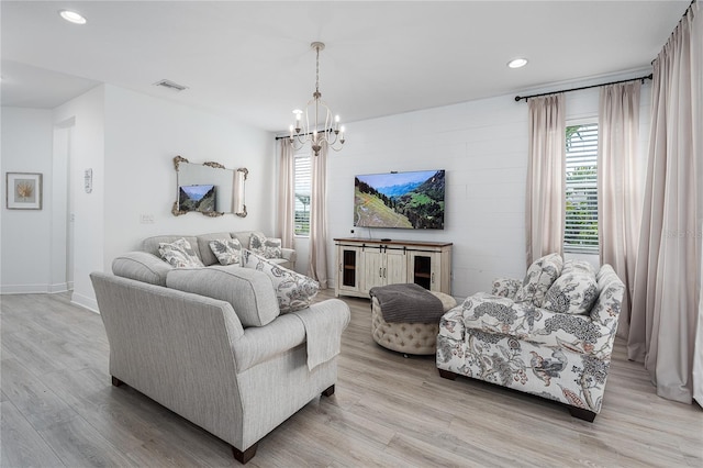 5651 Trevesta Pl, Palmetto, FL 34221 - living room featuring light wood-style flooring, recessed lighting, and a chandelier