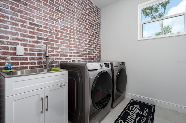5651 Trevesta Pl, Palmetto, FL 34221 - washroom featuring cabinet space, washing machine and dryer, and light tile patterned floors