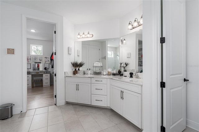 5651 Trevesta Pl, Palmetto, FL 34221 - bathroom with double vanity and tile patterned floors