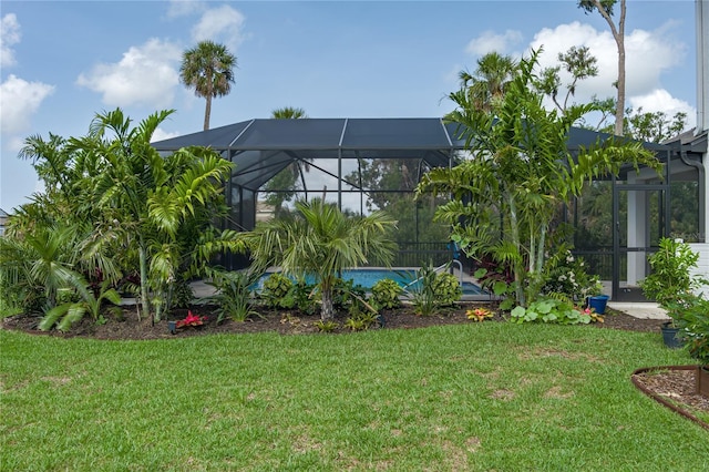 5651 Trevesta Pl, Palmetto, FL 34221 - view of grassy yard featuring an outdoor pool and glass enclosure