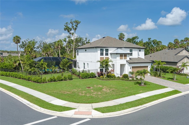 5651 Trevesta Pl, Palmetto, FL 34221 - view of front of home featuring stucco siding, driveway, and a shingled roof