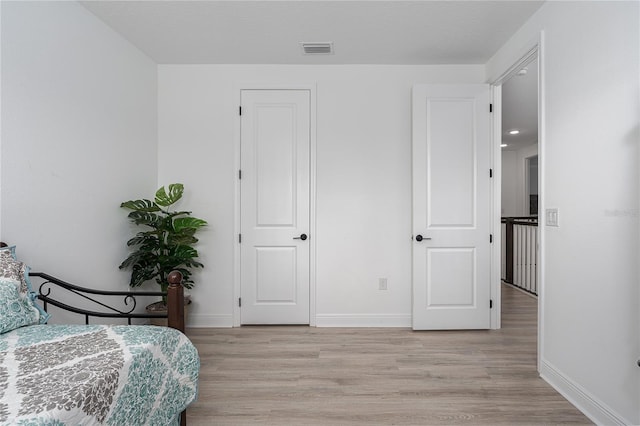 5651 Trevesta Pl, Palmetto, FL 34221 - bedroom featuring light wood-style flooring